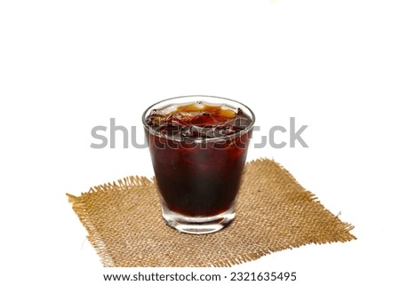 Put the Americano ice coffee on the sack brown color with concept isolated style.copy space and background.coffee americano ice. Royalty-Free Stock Photo #2321635495