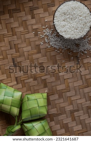 Ketupat or rice dumpling is a local delicacy during the festive season. Close up view of Ketupat, an Indonesian traditional cuisine very popular during Hari Raya Idul Fitri. Royalty-Free Stock Photo #2321641687