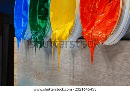 green yellow and orange paints are dripping from white barrel.
high quality 4k video.colorful of paint background.
plastisol ink is specially for print on tee shirts and any fabric. Royalty-Free Stock Photo #2321645433