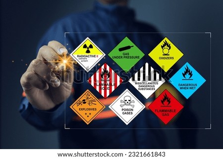 Security officers with virtual screen and inspect the storage of dangerous goods hazardous substance in the warehouse for operator safety such as explosions, radioactive, toxic gases