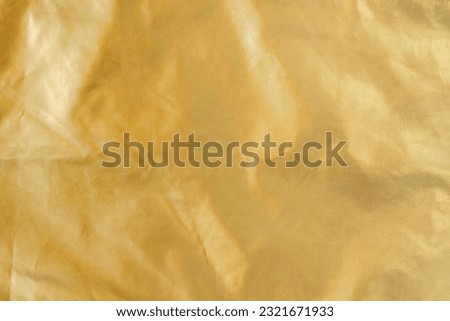 Golden background with copy space, raincoat fabric backdrop Royalty-Free Stock Photo #2321671933
