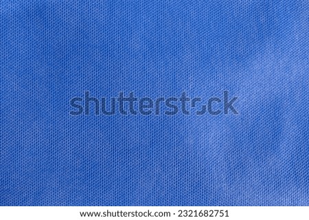 Blue fabric texture. Medical texture. Blue background. Surgical drape.. Closeup Image Of Blue Drape Sheet Using For Wrap Medical Surgical Instrument Before Sterilization.  Blue Drape Sheet. Royalty-Free Stock Photo #2321682751