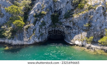 Entrance to an old deserted hidden boat base near Šibenik, Croatia