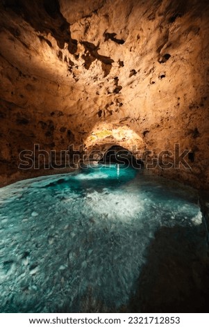 Underground Lake.. Cave of Tapolca, Hungary near Balaton lake. System of underground caves situated in the heart of the city. Boat trip Royalty-Free Stock Photo #2321712853