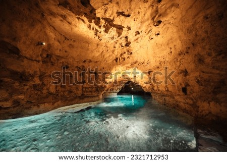 Underground Lake.. Cave of Tapolca, Hungary near Balaton lake. System of underground caves situated in the heart of the city. Boat trip Royalty-Free Stock Photo #2321712953