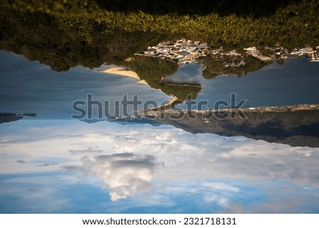 Amanohashidate daytime reversed shot with blue sky and cloud upside down Royalty-Free Stock Photo #2321718131
