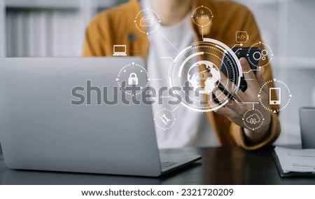 Person typing laptop computer and tablet with SDK icon on virtual screen. SDK Software development kit programming language technology concept in office. Royalty-Free Stock Photo #2321720209
