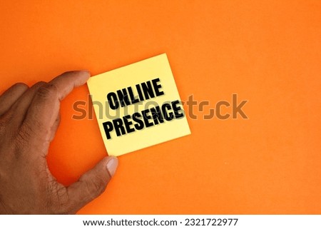 hand holding colored paper with online presence word. online presence concept