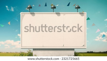 Large vintage billboard sign with white posters and string flags, advertising and communication concept