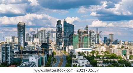 Warsaw city center aerial landscape, skyscrapers panorama under blue cloudy sky