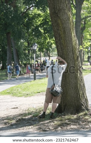NEW YORK - USA - 14 JUNE 2015 people is spending time amusing in central park on sunny sunday