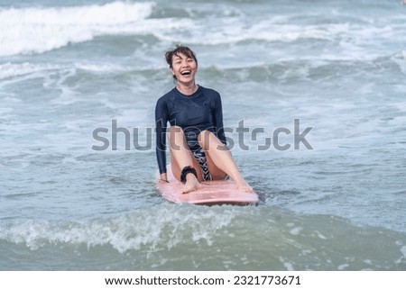 asian woman, wave, surf board, sporty, boarding, paddleboard, sup, happy, sunrise, woman, paddle, slim, sky, freedom, tropical, fit, surfboard, healthy, attractive, surfing, surfer, swim, tourist, smi Royalty-Free Stock Photo #2321773671