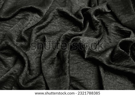 black fabric with lots of wrinkles gives it a very nice texture perfect for a backdrop