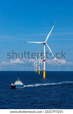 Offshore wind farm and CTV Royalty-Free Stock Photo #2321797255