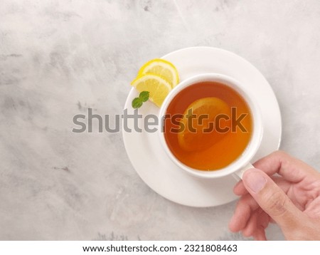 A cup of hot lemon tea. Isolated background in white. Top view or flat lay photography