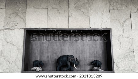 Picture of an elephant in a beautiful wooden frame