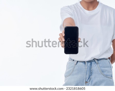 Woman showing smartphone on white background, closeup. Space for text