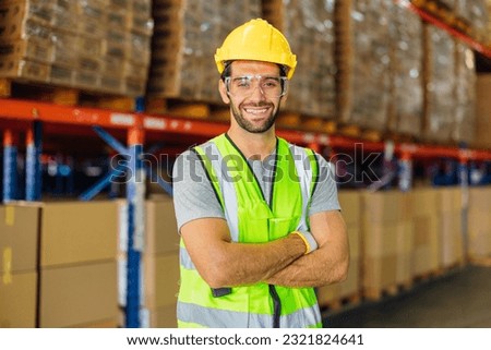 Warehouse workers using a digital tablet while recording inventory. Logistics employees working with warehouse management software in a large distribution centre. Royalty-Free Stock Photo #2321824641