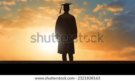 College graduate commencement day looking out to future success Royalty-Free Stock Photo #2321838163