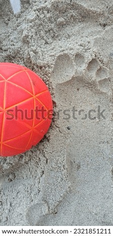 Beach handball ball close up on a sandy beach with a copy space