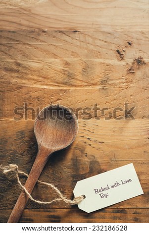 Old wooden spoon with baked with love tag