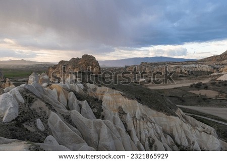 A picture of the Meskendir Valley, part of the Goreme Historical National Park, during a rainy sunset.