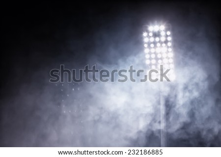 stadium lights and smoke Royalty-Free Stock Photo #232186885