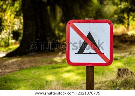 No camping sign with nature background