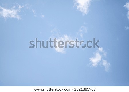 white clouds blue sky, bright blue background