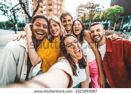 Multicultural friends taking selfie pic with cellphone outside - Happy young people having fun hanging out on city street - Summer vacation concept with guys and girls enjoying summertime holiday
