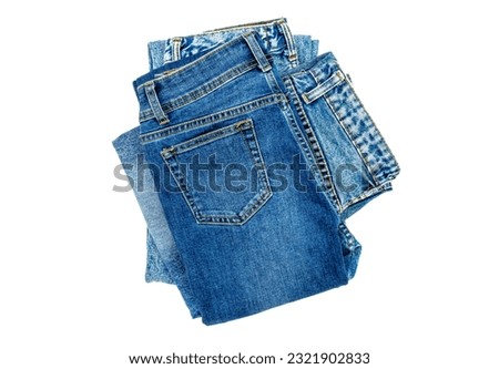 Blue jeans lined in a pile of jeans elements modern women's and men's fashion pants isolated cut-out background - clipping path