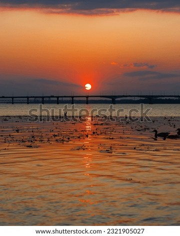 Panoramic view of the city of Dnipro during sunset or sunrise. Amazing sunset at Dnipro river with a view of the historical center. Warm days. background image. Ukrainian city.
