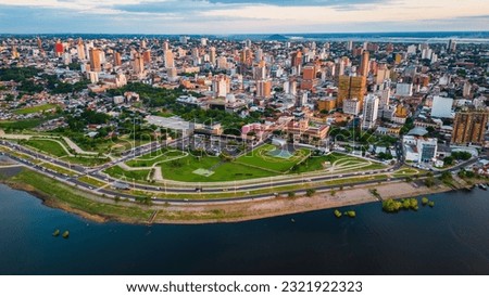 Aerial Drone Fly Above Asuncion City Waterfront in Paraguay, Daylight Cityscape Panorama of South American River Royalty-Free Stock Photo #2321922323