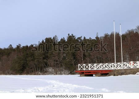 Frozen lake during the winter. Landscape photo. Covered in snow and foot prints. Stockholm, Sweden, Scandinavia, Europe.