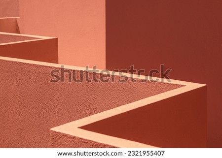 abstract orange earth tone architecture background, colorful exterior walls corners design. bright illuminated geometric shapes. Angular. Polygonal triangles pattern. warm muted shades. empty room Royalty-Free Stock Photo #2321955407