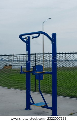 Blue metal outdoor exercise equipment on the edge of Boca Ciega Bay in Gulfport, Florida.