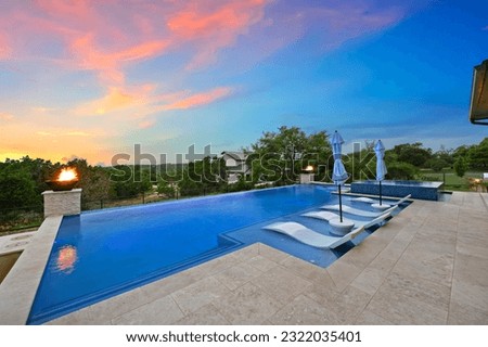 a luxury pool at sunset 