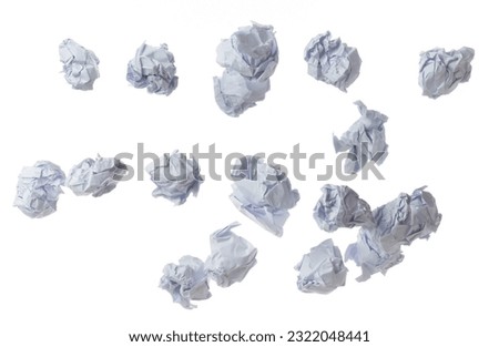 Crumpled paper ball is symbol of frustration discarded ideas, isolated white background. Crumpled paper ball write creative process, problem-solving, potential innovation. Many recycle paper angle Royalty-Free Stock Photo #2322048441