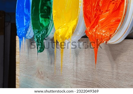 green yellow and orange paints are dripping from white barrel.
high quality 4k video.colorful of paint background.
plastisol ink is specially for print on tee shirts and any fabric.