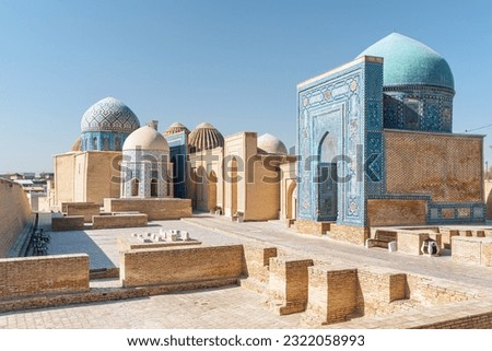 Awesome view of the Shah-i-Zinda Ensemble in Samarkand, Uzbekistan. Mausoleums decorated by blue tiles with designs. The necropolis is a popular tourist attraction of Central Asia. Royalty-Free Stock Photo #2322058993