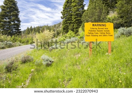 A sign in the Modoc National Forest warns travelers that they are entering a burned area (Blue Fire of 2001) Royalty-Free Stock Photo #2322070943