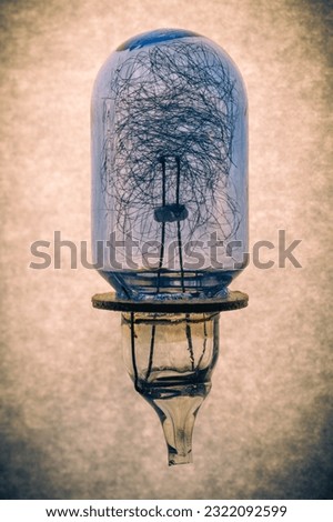 unused old flash lamp with beige marbled background and slight vignetting