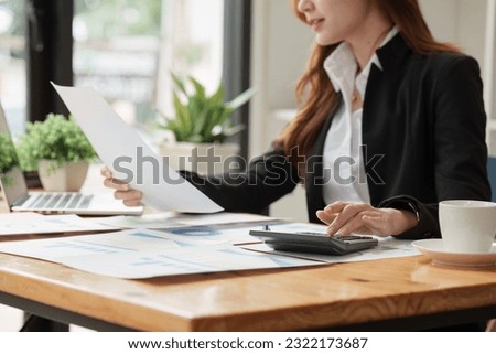Accountant woman working on laptop and do document, tax, exchange, research, accounting and Financial advisor concept Royalty-Free Stock Photo #2322173687