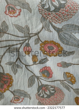 Floral printed cotton fabric in grey, light peach, yellow and off white colours.