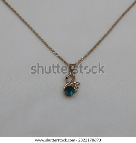 A women's necklace made of gold for advertising photography.