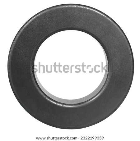 Large ring made from ferrite used by two-way radio operators to reduce noise coming in through their antenna lines Royalty-Free Stock Photo #2322199359