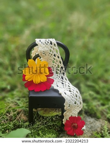 Still life photography macro with flowers and lace, selected focus with blurry abstract background