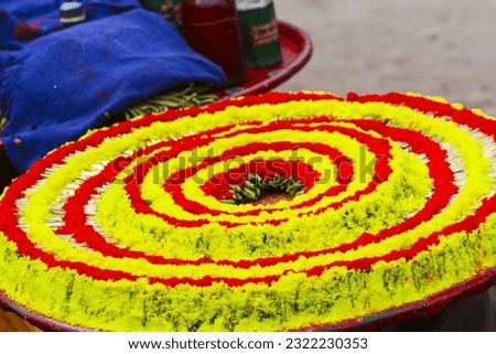Close-Up Photo of Flower Petals Arrangement
Flower Rangoli for Diwali or Pongal Festival made using Marigold or Zendu flowers and Rose petals over moody or white background, selective focus
Captions a