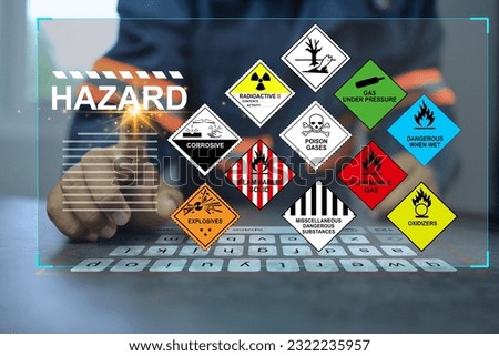 Security officers with virtual screen and inspect the storage of dangerous goods hazardous substance in the warehouse operator to safety such as explosions, radioactive, toxic gases Royalty-Free Stock Photo #2322235957