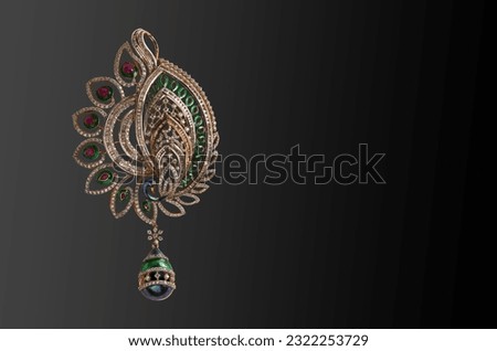 peacock pendant designs in gold.traditional Indian jewelry technique that involves setting gemstones, 
usually uncut diamonds or polki, in gold.